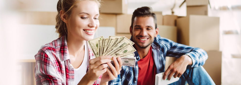Gale Credit Union woman holding money with man